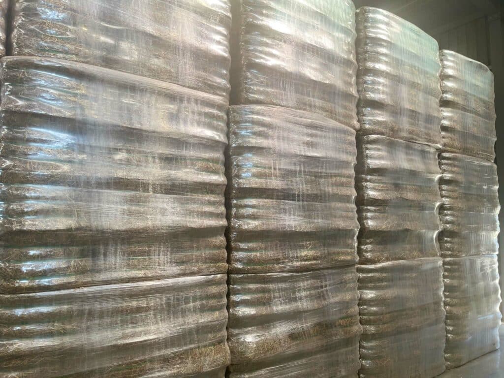 A stack of plastic bags stacked in a warehouse.